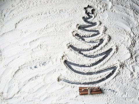 Shaped christmas tree of flour star and cinnamon.