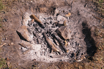 coals on the ground after the fire