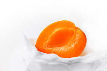 Yogurt with Fresh delicious apricot. Half of juicy apricot in yogurt