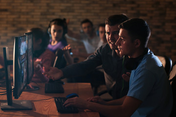 Young people playing video games at tournament