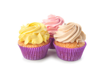 Delicious cupcakes on white background