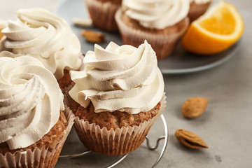Delicious cupcakes on grey table, closeup