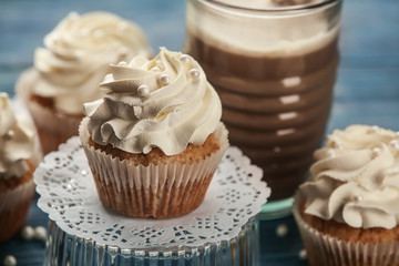 Tasty fresh cupcake on stand