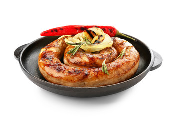 Frying pan with delicious roasted sausage and vegetables on white background