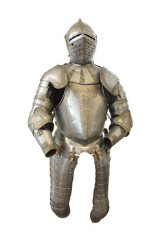 Metal helmet and armor of a medieval knight on a white background