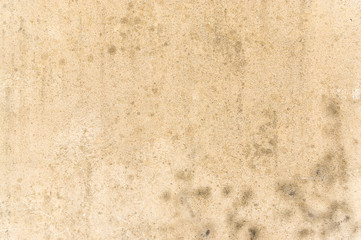 verwitterte und schmutzige Fassade aus Betonputz als Hintergrund, weathered and dirty facade of concrete plaster as a background