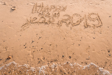 New Year 2019 is a concept - the inscription 2019 on a sandy beach