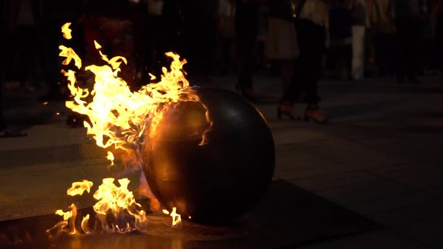 Fire ball: benzene dripping on a metallic sphere, creating a fire show