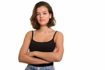 Portrait of young beautiful Caucasian teenage girl with arms crossed