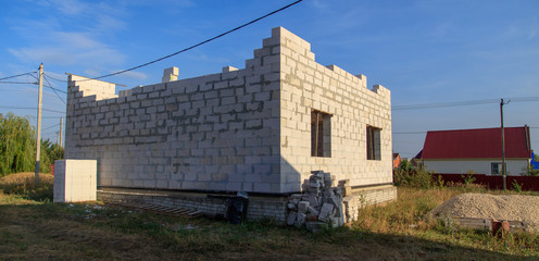 Obraz premium Brick house under construction in the village