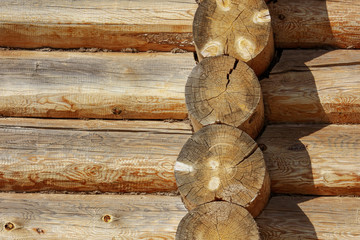 Wall with log house in the house as a background