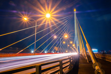 Obraz premium Landscape Rama 8 Bridge at night. a bridge across the Chao Phraya River. In Bangkok Thailand. It is a beautiful place and a landmark of the country.