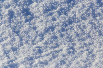 White snow on nature as an abstract background