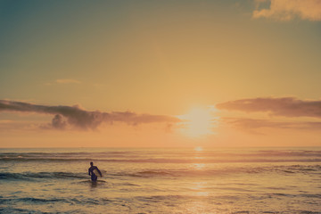 Fototapeta premium Surfer at Sunset