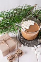 Hot cocoa and gift. Christmas mood