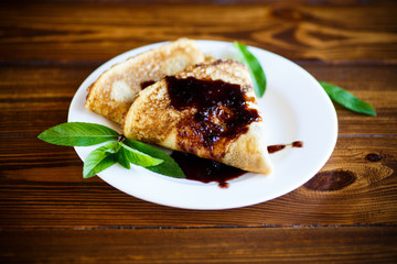 fried pancakes thin on a white plate