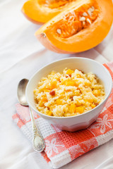 Milky cereal porridge with pumpkin and raisins
