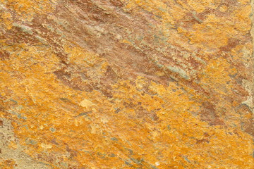 orange and brown textured background made from stone