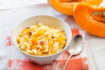 Milky cereal porridge with pumpkin and raisins
