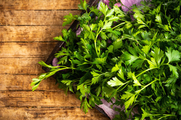 Fresh parsley on a wooden background