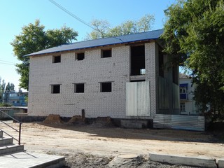 Construction of a brick house. Two-storey country cottage. New real estate.