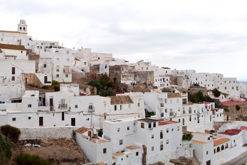 Architectural complex consisting of white houses next to each other on top of a mountain, is situated in the municipality of Vejer de la Frontera in the province of Cadiz in Spain 