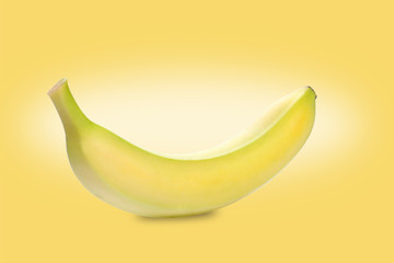 banana on yellow background with copy space