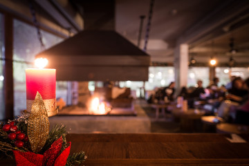 Romantic scene in restaurant, candle and fireplace