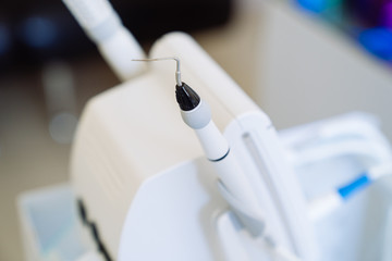 Close-up medical equipment of a dentist in the hands of a doctor. dental clinic, concept of healthy.