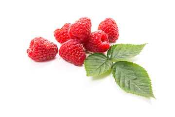 Ripe raspberries with leaf isolated on white background.