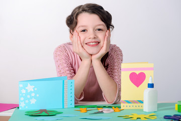 Girl resting after making cards