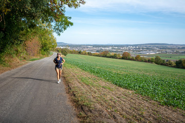 Person walking on rural road in France - 229718020