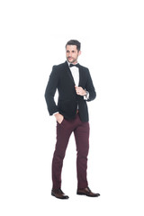 Obraz premium handsome man in fashionable suit looking away isolated on white