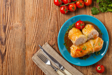Traditional stuffed cabbage with minced meat and rice, served in a tomato sauce.