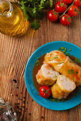 Traditional stuffed cabbage with minced meat and rice, served in a tomato sauce.
