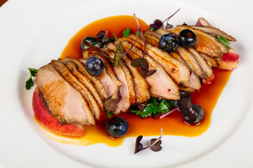 Baked duck breast with peach