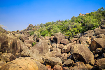 Fototapeta na wymiar Fallen boulders in Matobo National Park, Zimbabwe, formed by millions of years of erosion. September 11, 2016.