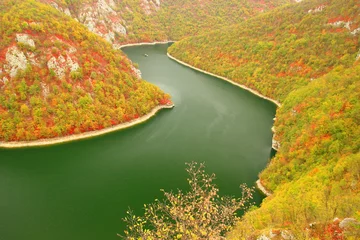 Zelfklevend Fotobehang Fall landscape with river and colorful forest © Simun Ascic