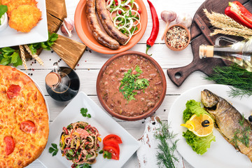 A set of food. Georgian cuisine. On a white wooden background. Free space for text. Top view.