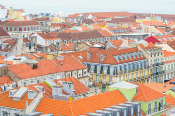 Lisbon houses with roofs covered  with red tile.
