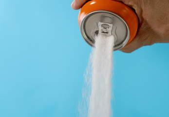 Can pouring sugar stream in calories content of soda energetic and refreshing drinks