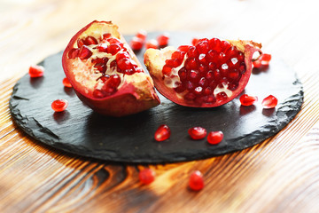 Juicy pomegranates on wood

