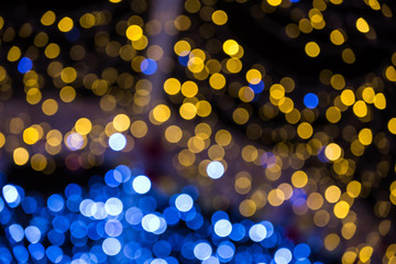 Abstract christmas background with colorful bokeh light effects