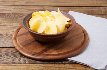 potato chips and napkin on wooden table, holiday concept,mock up