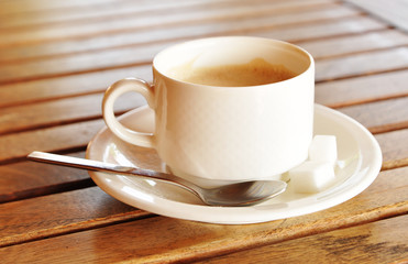 Cup of coffee on table in coffee shop
