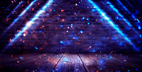 Dark basement room, empty old brick wall, sparks of fire and light on the walls and wooden floor....