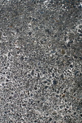 Close up of wall and pavement texture for creativity, imaginative backgrounds and ideas. Suitable for print, web, postcards, posters, flyers.
