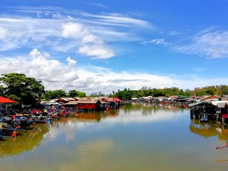 Fototapeta na wymiar Riverside community in the afternoon.Narathiwat, Thailand
