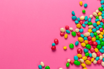 Colorful lollipops on a pink background