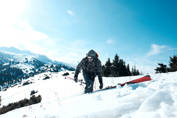 Fototapeta na wymiar Skitouring with amazing view of swiss famous mountains in beautiful winter powder snow of Alps
